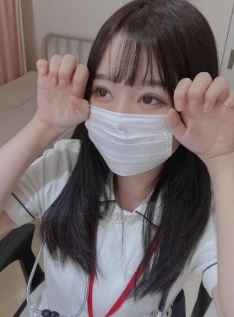 A cute Japanese escort in nurse cosplay with a mask, offering a gentle and healing adult service in Osaka, ideal for foreign tourists looking for a soft and playful experience beyond typical soaplands.